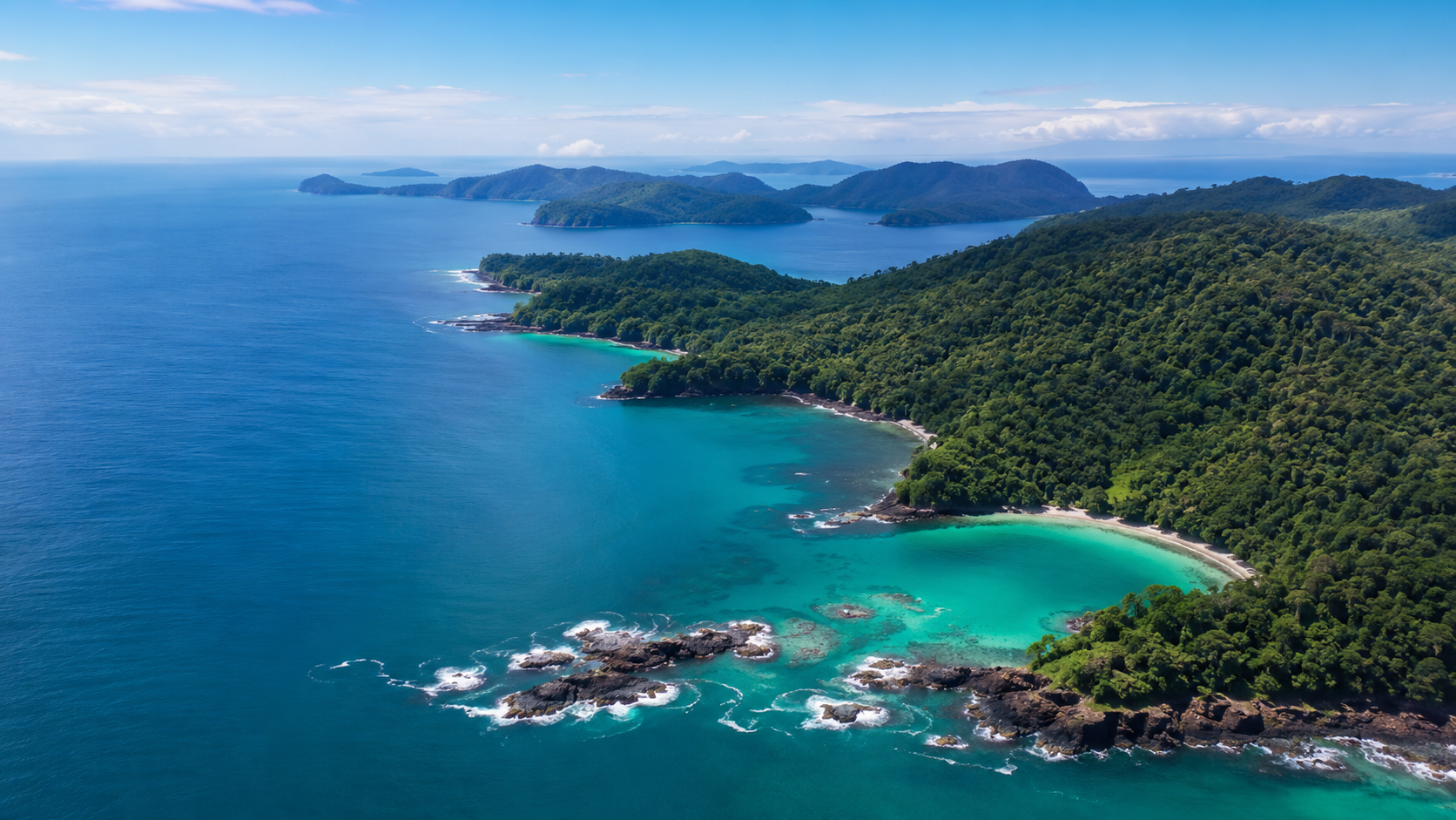 Aerial-style view of forested Pacific islands and turquoise water inspired by Coiba National Park